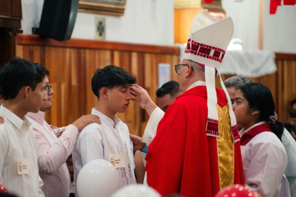 Boy being Confirmed into the Catholic church
